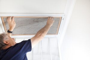 Man replacing dusty AC filter.